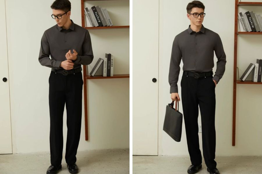 Chàng trai lịch lãm với áo sơ mi tay dài màu xám than phối cùng quần tây đen, thể hiện phong cách darkwear nam tính và sang trọng.