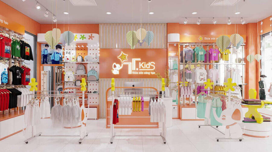 Hình ảnh mẫu shop quần áo trẻ em độc đáo với cây trang trí lớn làm điểm nhấn, không gian đầy màu sắc