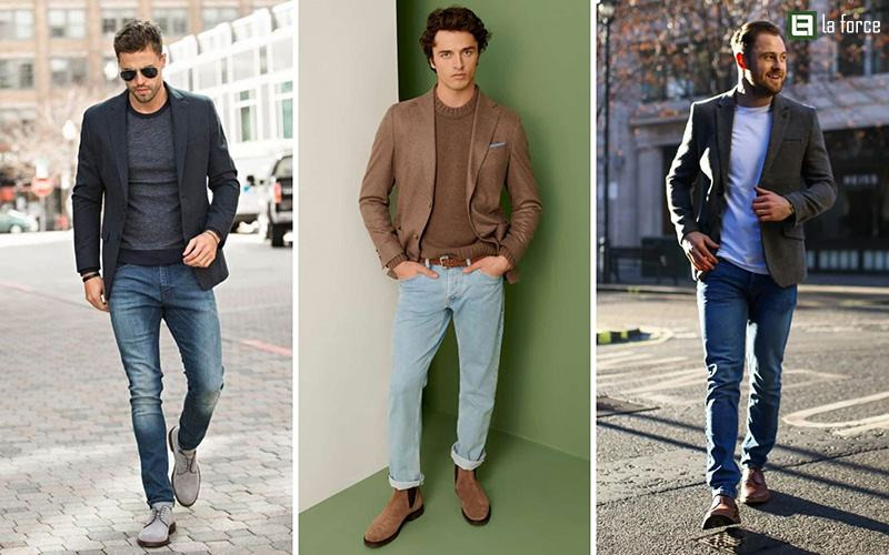 Nam giới lịch lãm với áo vest xám kết hợp áo pull tay dài màu trắng và quần jean xanh đậm