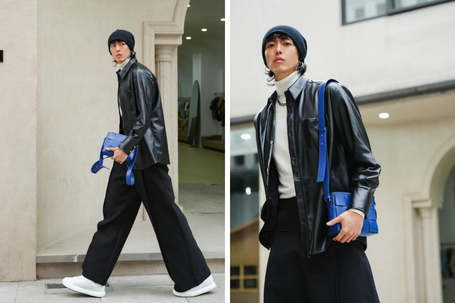 Tạo outfit thời thượng với áo sơ mi da màu đen, phối cùng áo tanktop trắng và quần ống rộng, đi kèm giày thể thao cá tính.