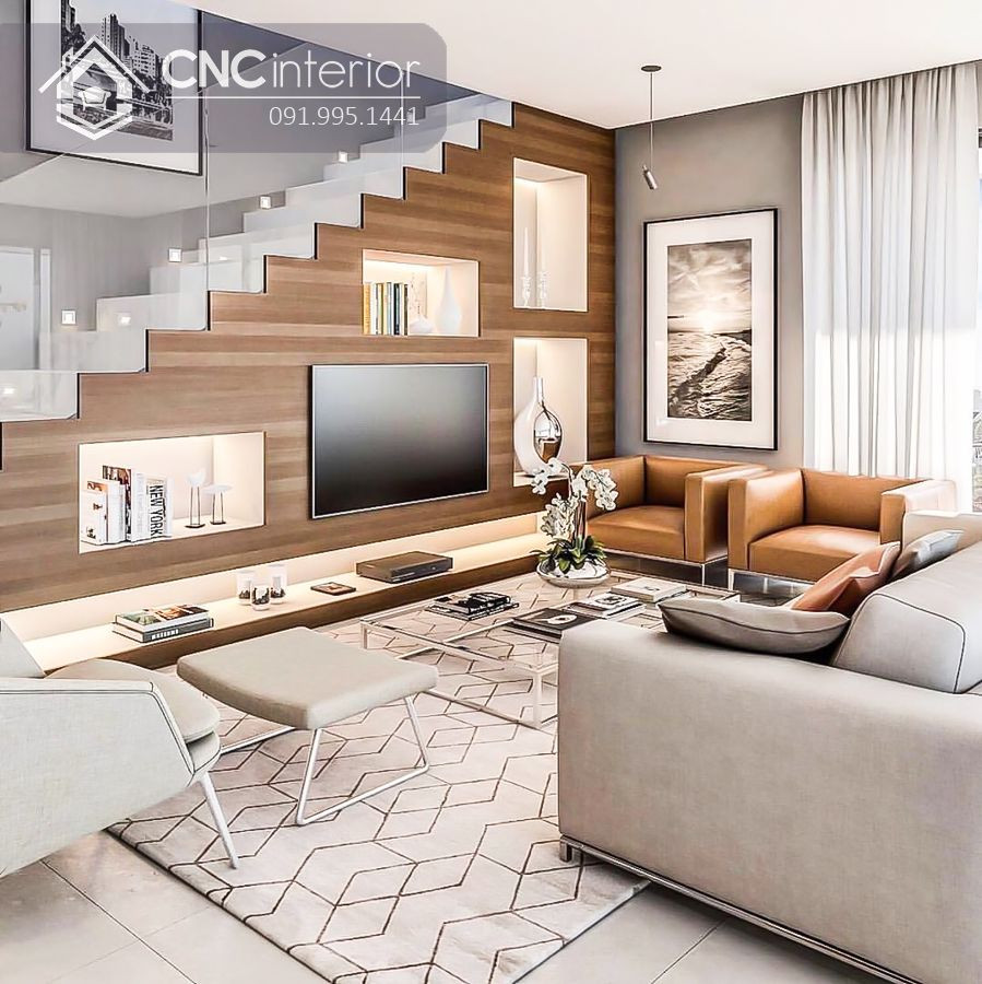 Tủ tivi và kệ trang trí tích hợp dưới gầm cầu thang phòng khách, mang đến vẻ đẹp hiện đại và tối ưu không gian giải trí