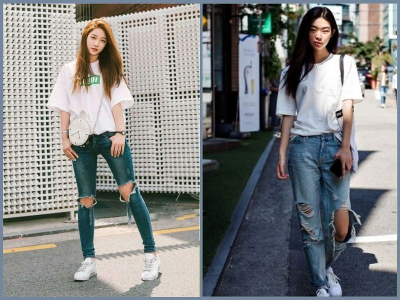 Áo phông rộng màu đen phối cùng quần jean rách gối sáng màu, tạo vẻ ngoài cá tính ấn tượng