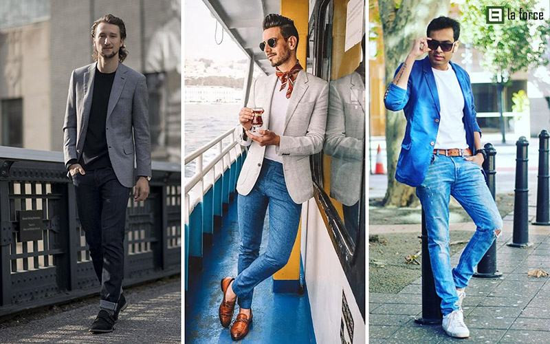 Chàng trai thanh lịch với áo vest xám, áo phông cổ tim trắng basic và quần jean xanh đậm, tạo vẻ ngoài trẻ trung