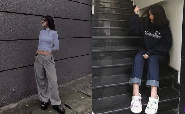 Cô gái cá tính mặc áo hoodie đen, quần kaki ống rộng màu xám và giày Crocs cổ điển, tạo nên outfit độc đáo