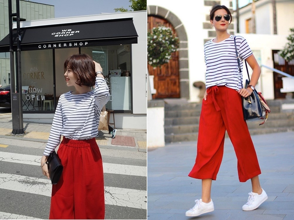 Phối quần đỏ đô cùng áo thun sọc đen trắng và sneaker trắng tạo phong cách công sở năng động