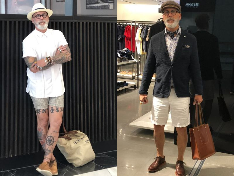 Quý ông trung niên lịch lãm trong bộ suit màu xám đậm, tôn vinh phong cách trưởng thành và sang trọng.